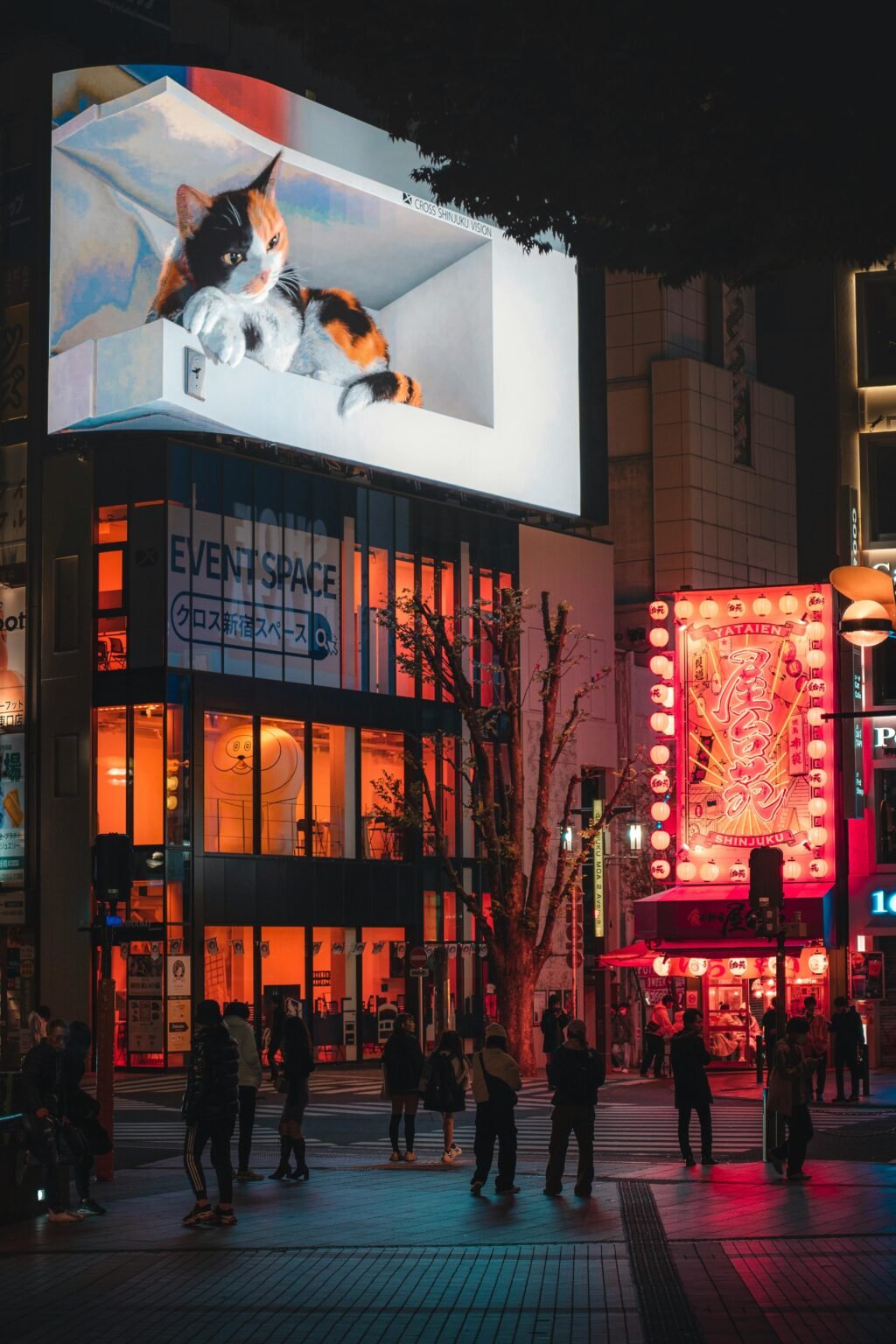 Explore Shinjuku's nightlife with vibrant billboards and bustling streets in Tokyo, Japan.